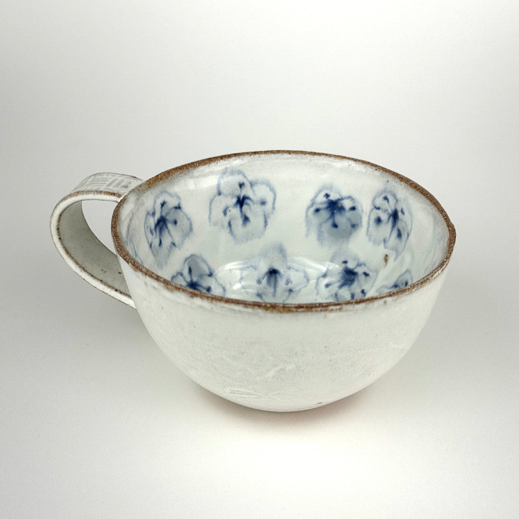Cappuccino Cup With Scattered Flowers