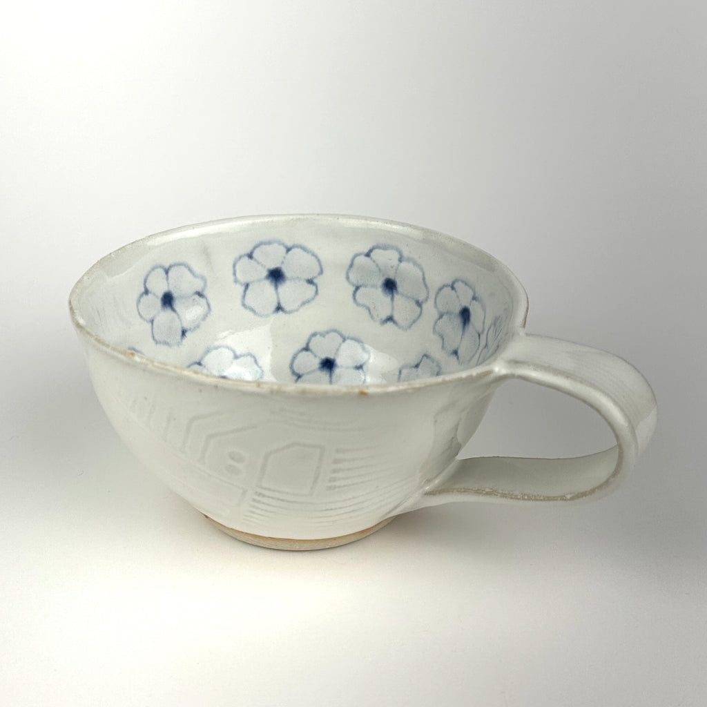 Cappuccino Cup with Scattered Flowers